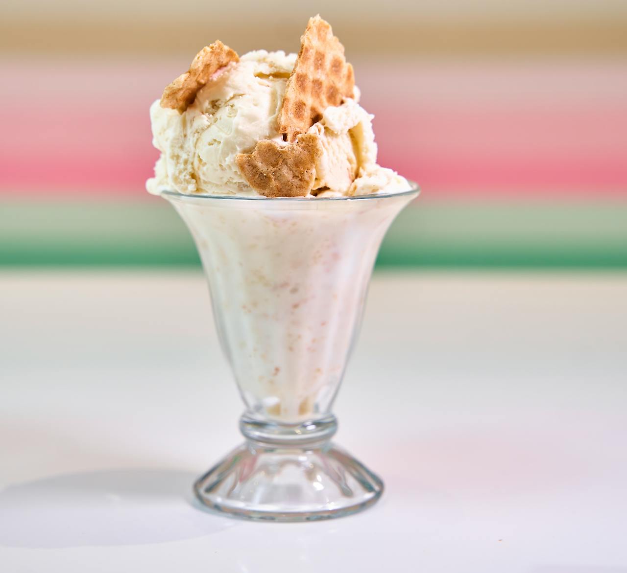 Close-up of a dessert cup with ice cream and waffle pieces. Indulgence at its finest.